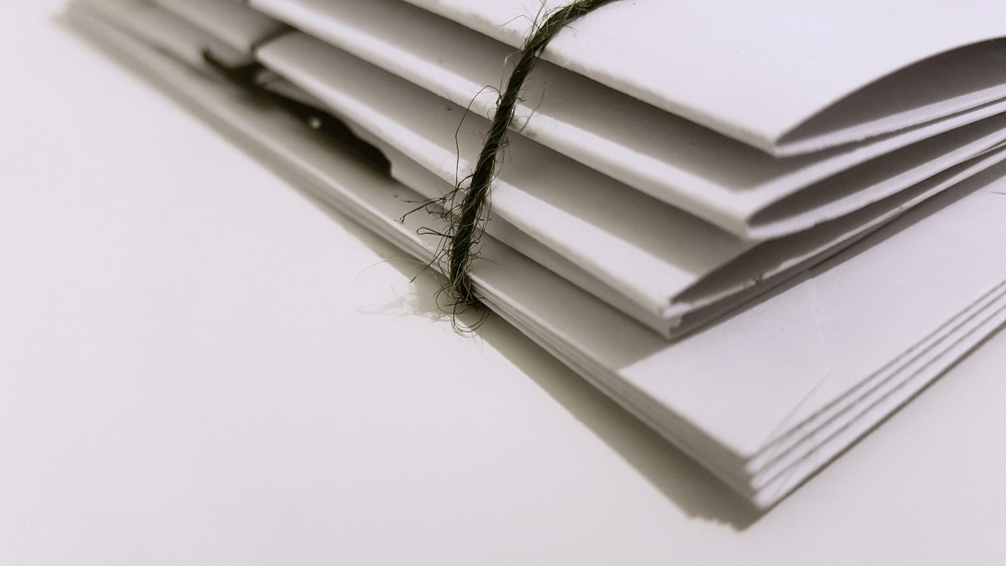image of stacked documents representing articles