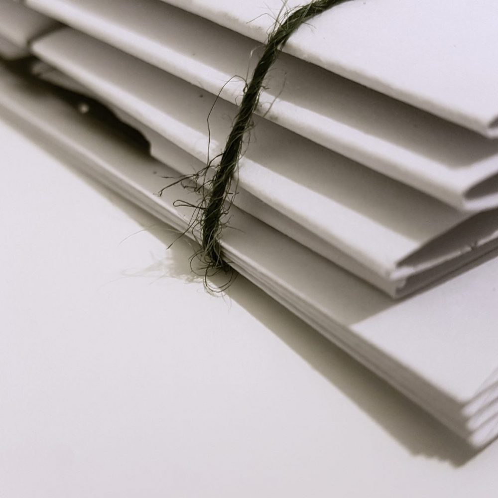 image of stacked documents representing articles